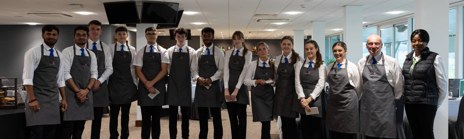 The waiting staff at Chepstow Racecourse pose for a picture before guests arrive