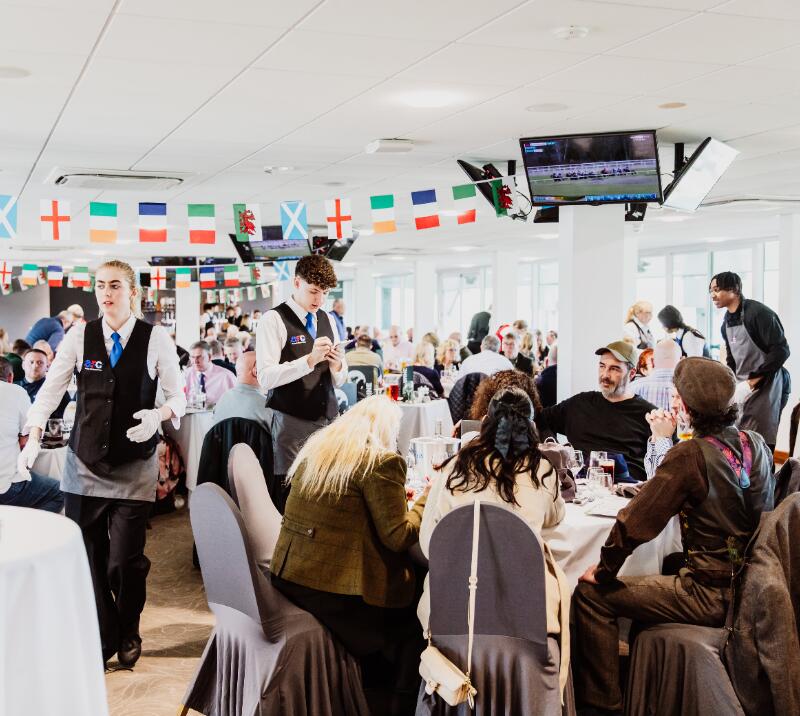 Waiting staff look after hospitality guests at Chepstow Racecourse