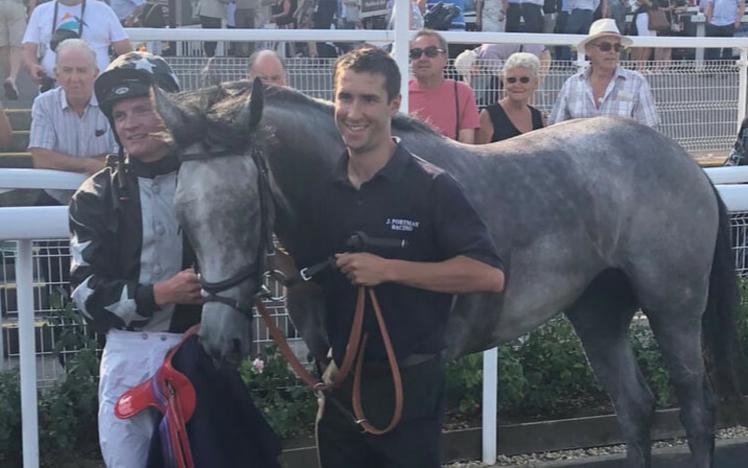 Jockey and Handler with their successful horse.