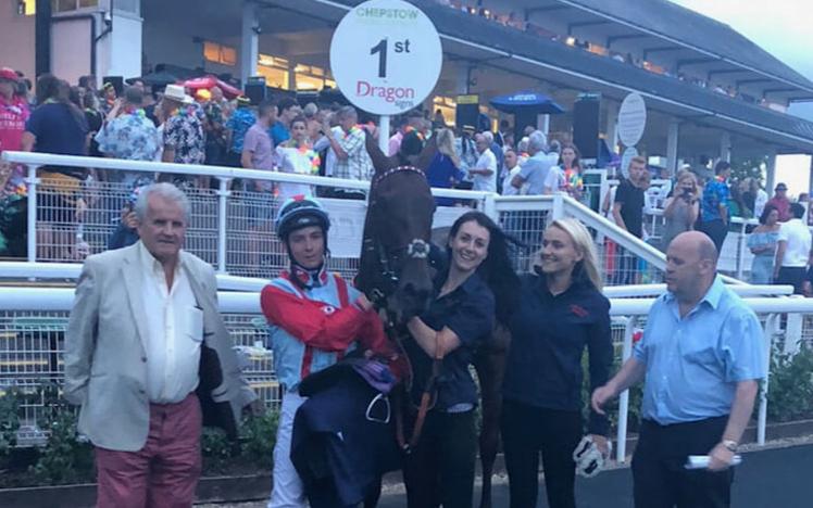 A successful team pose with their horse following a good day at Chepstow Racecourse