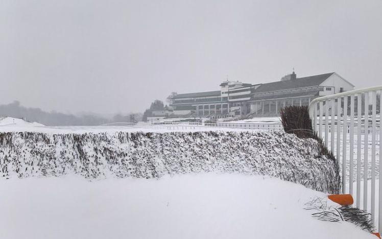 Snow covering the ground, fences and everything else at Chepstow Racecourse.