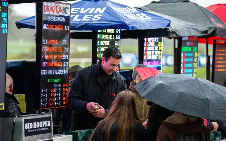 A line of bookmakers at Chepstow Racecourse