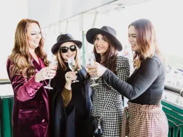 Four ladies toast champagne at Chepstow Races