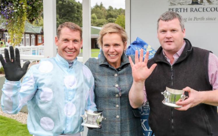 Champion Jockey Richard Johnson celebrates with colleagues.