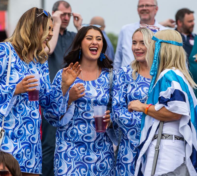 A group of guests at Chepstow Races in fancy dress having a good laugh