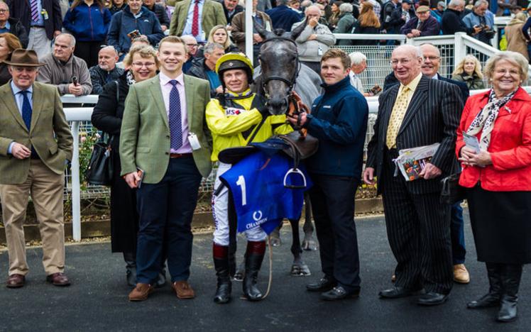 Jockey Richard Johnson poses with members of the team in charge of Gumball.